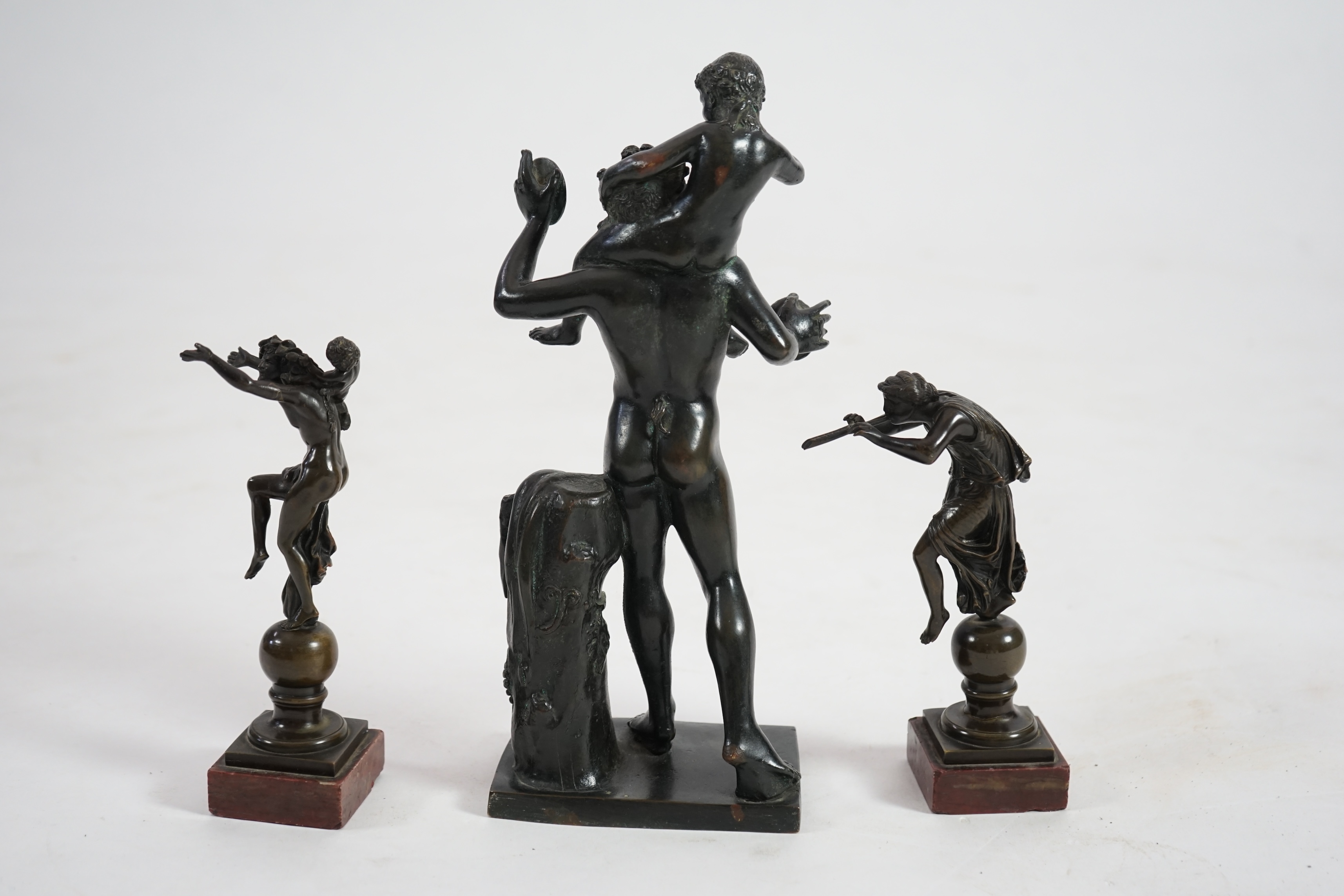 After the antique, three classical bronzes, faun with child Dionysius